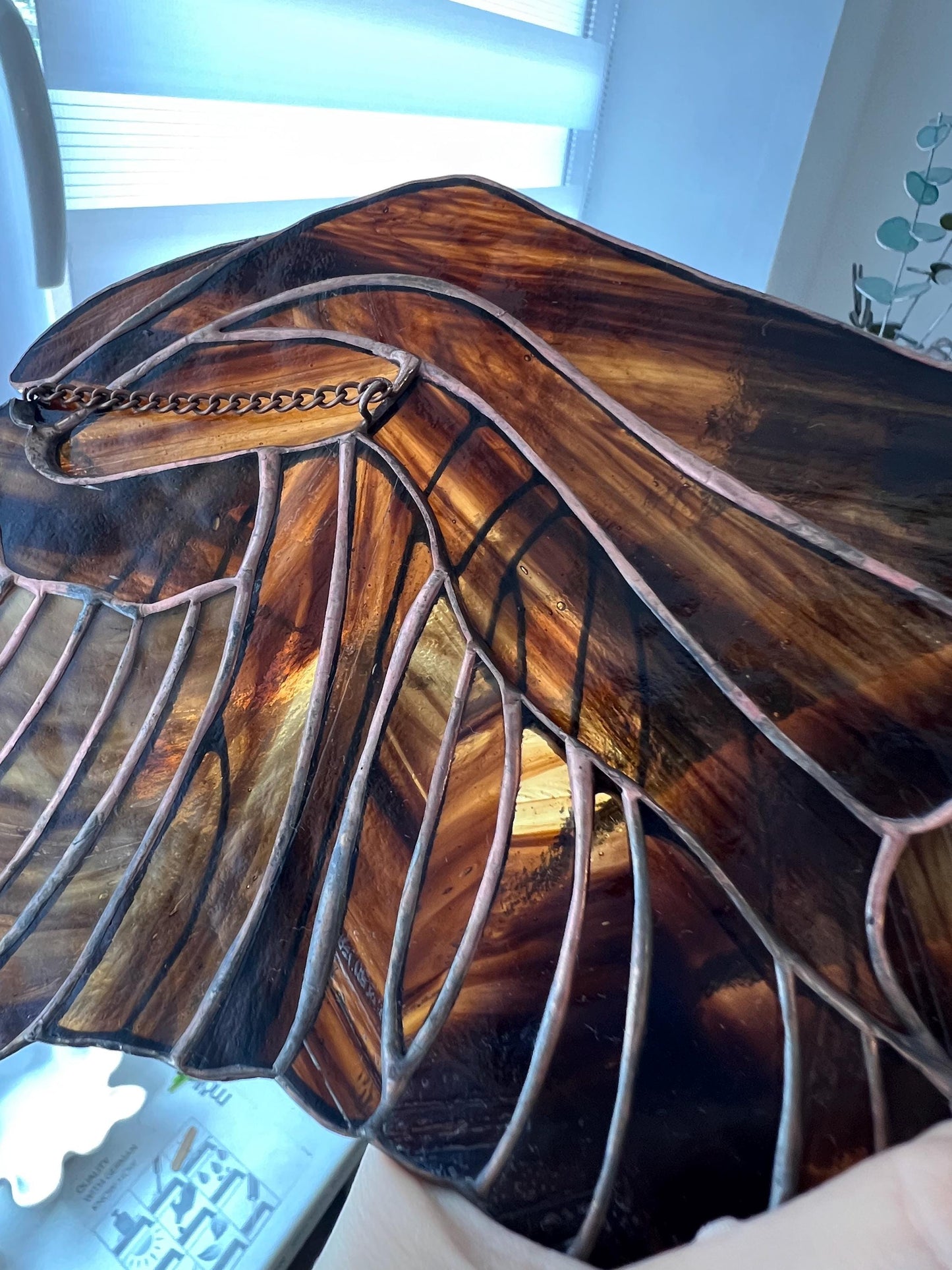 Detailed wing texture of stained glass eagle suncatcher