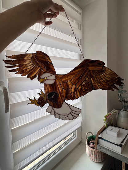 Eagle glass suncatcher catching sunlight in window