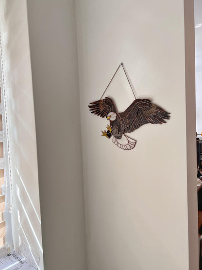 Side view of large bald eagle window hanging