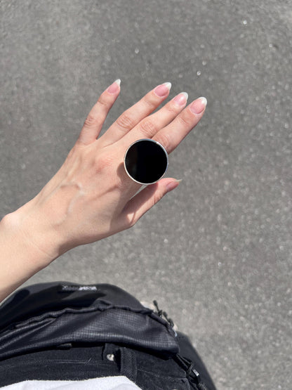 Large round stained glass ring in black, minimalist geometric style.