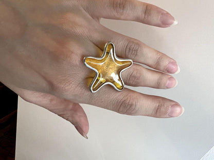 Yellow stained glass ring catching sunlight – statement women’s accessory.