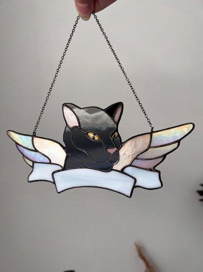Handmade stained glass cat tribute against neutral background