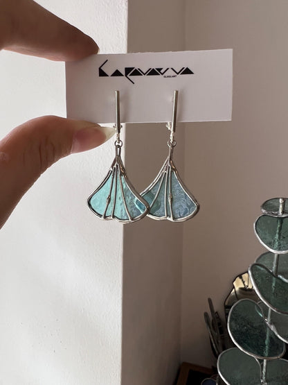 Handmade stained glass earrings in mint green shaped like ginkgo leaves, botanical nature-inspired jewelry, elegant dangle design