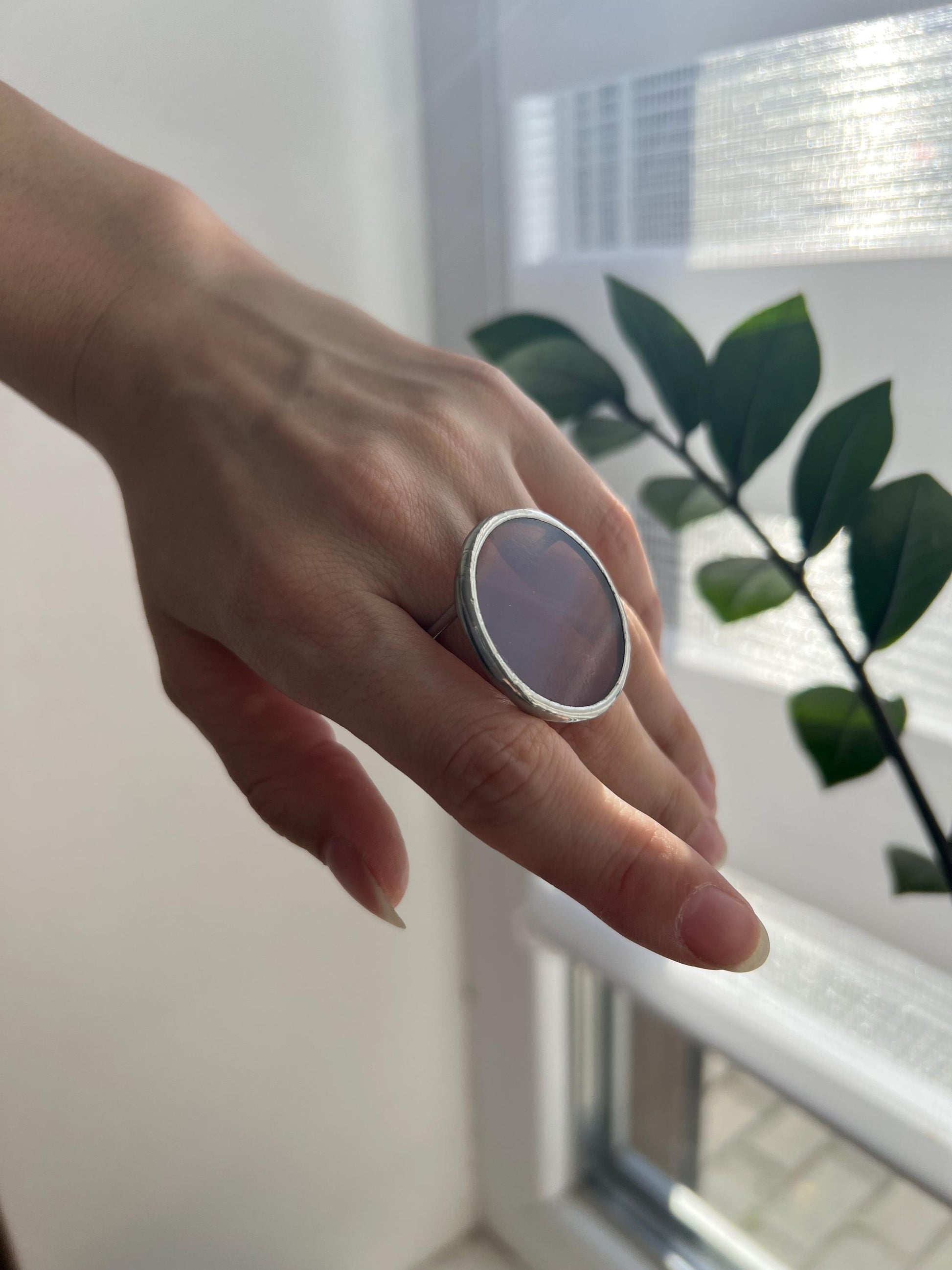 Large geometric stained glass ring reflecting sunlight