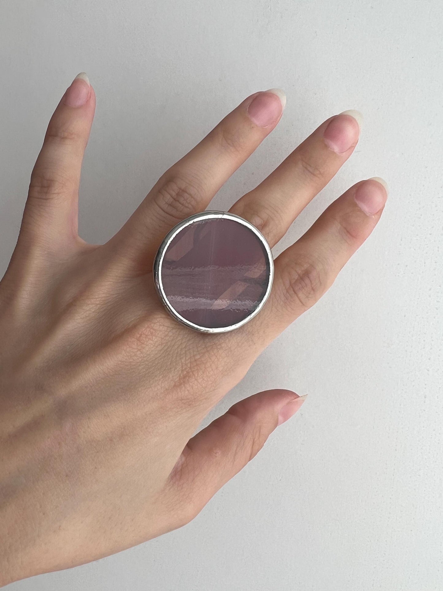 Large disc ring on finger, minimalist design