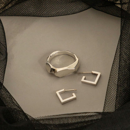 May include: in the photo two square silver earrings and a silver stylized ring. you can also see other jewelry in my store