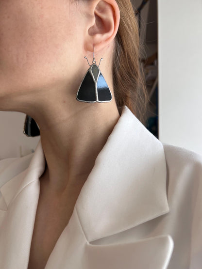 Close up of stained glass moth earrings gift idea