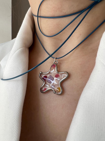 Handmade fused glass starfish necklace on model