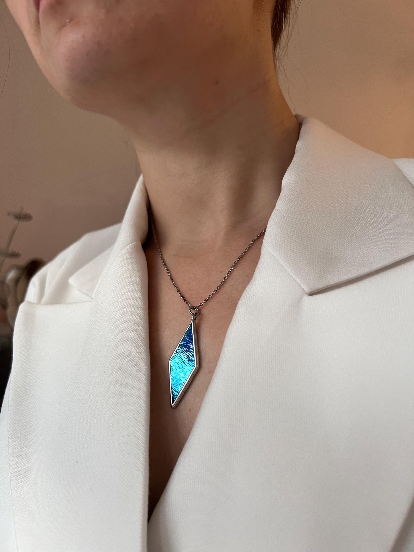 A bright stained glass pendant for lovers of geometric jewelry.