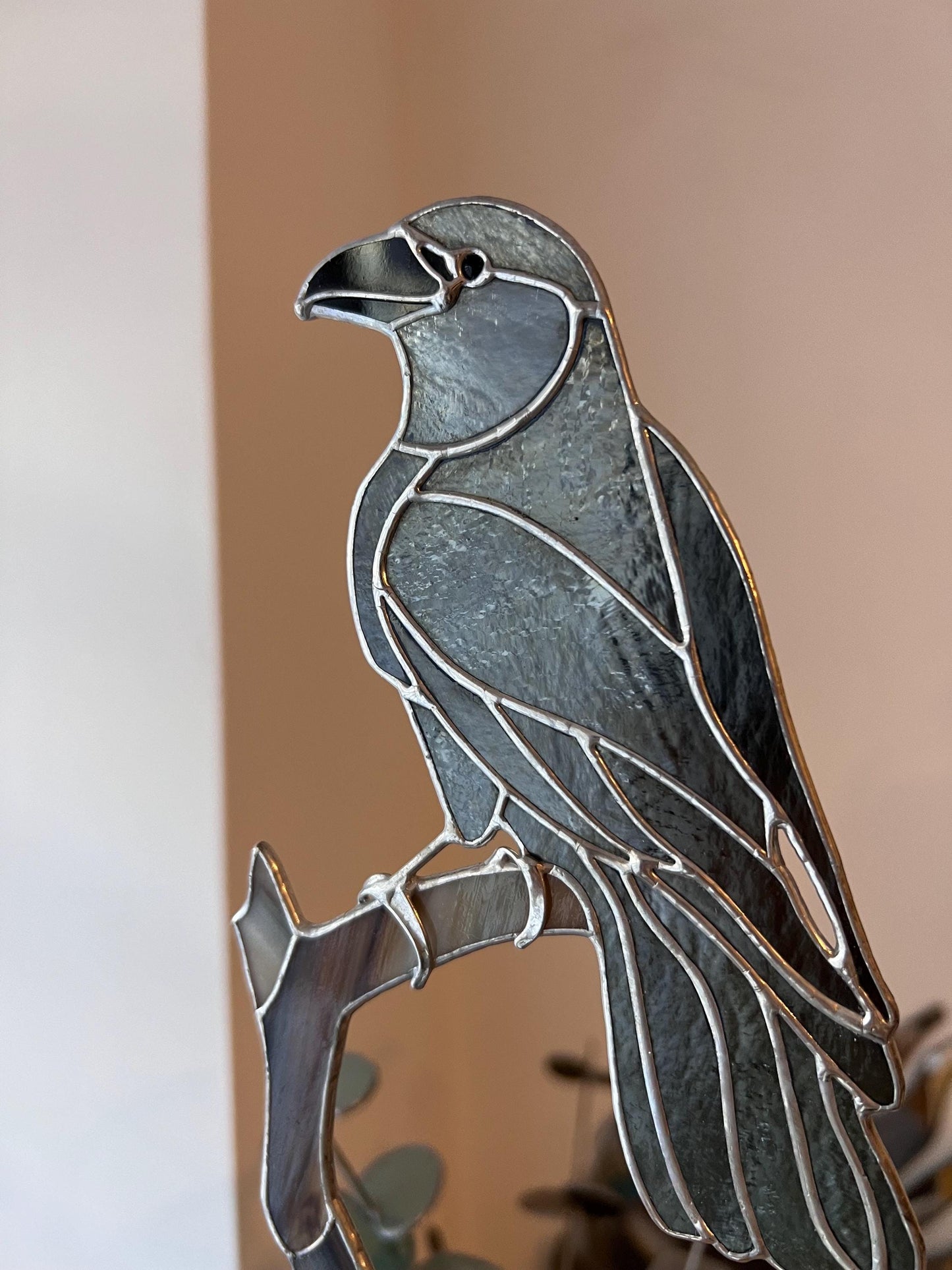 Elegant stained glass bird ornament on wooden base – living room decor