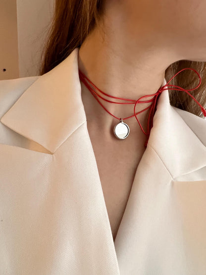Red cord minimalist mirror choker on model