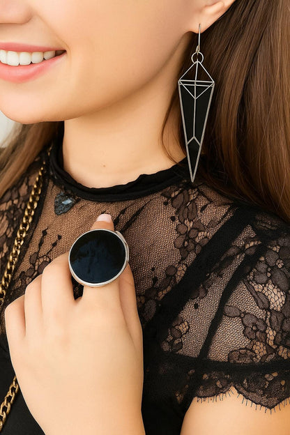 Black glass statement earrings styled with modern outfit