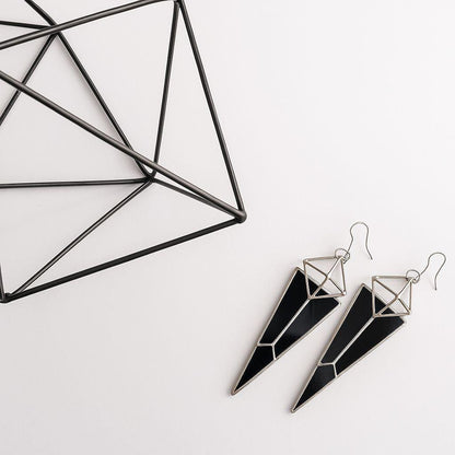 Black geometric stained glass earrings on white background, architectural handmade jewelry