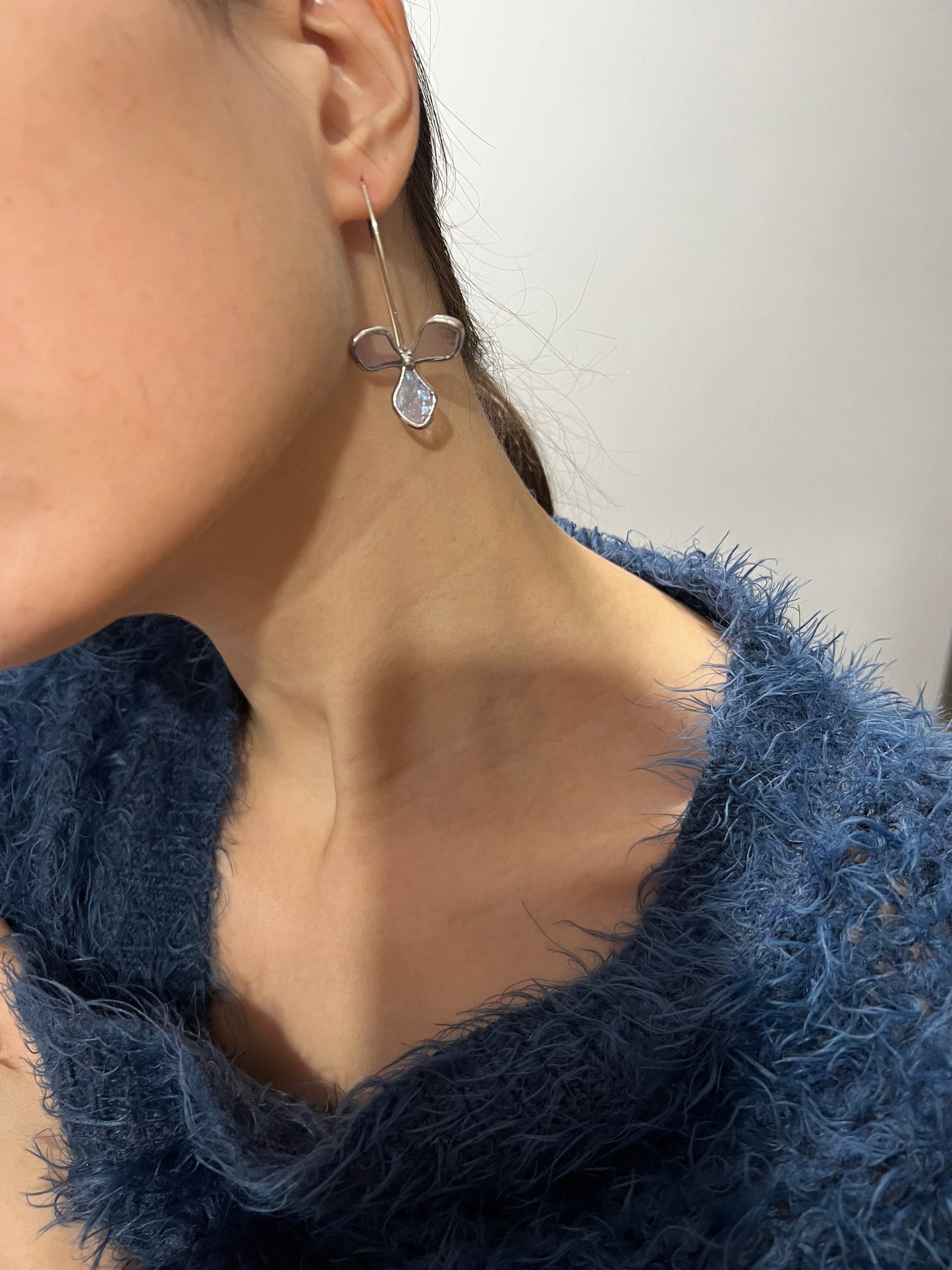 Light purple stained glass hydrangea earrings on model close-up