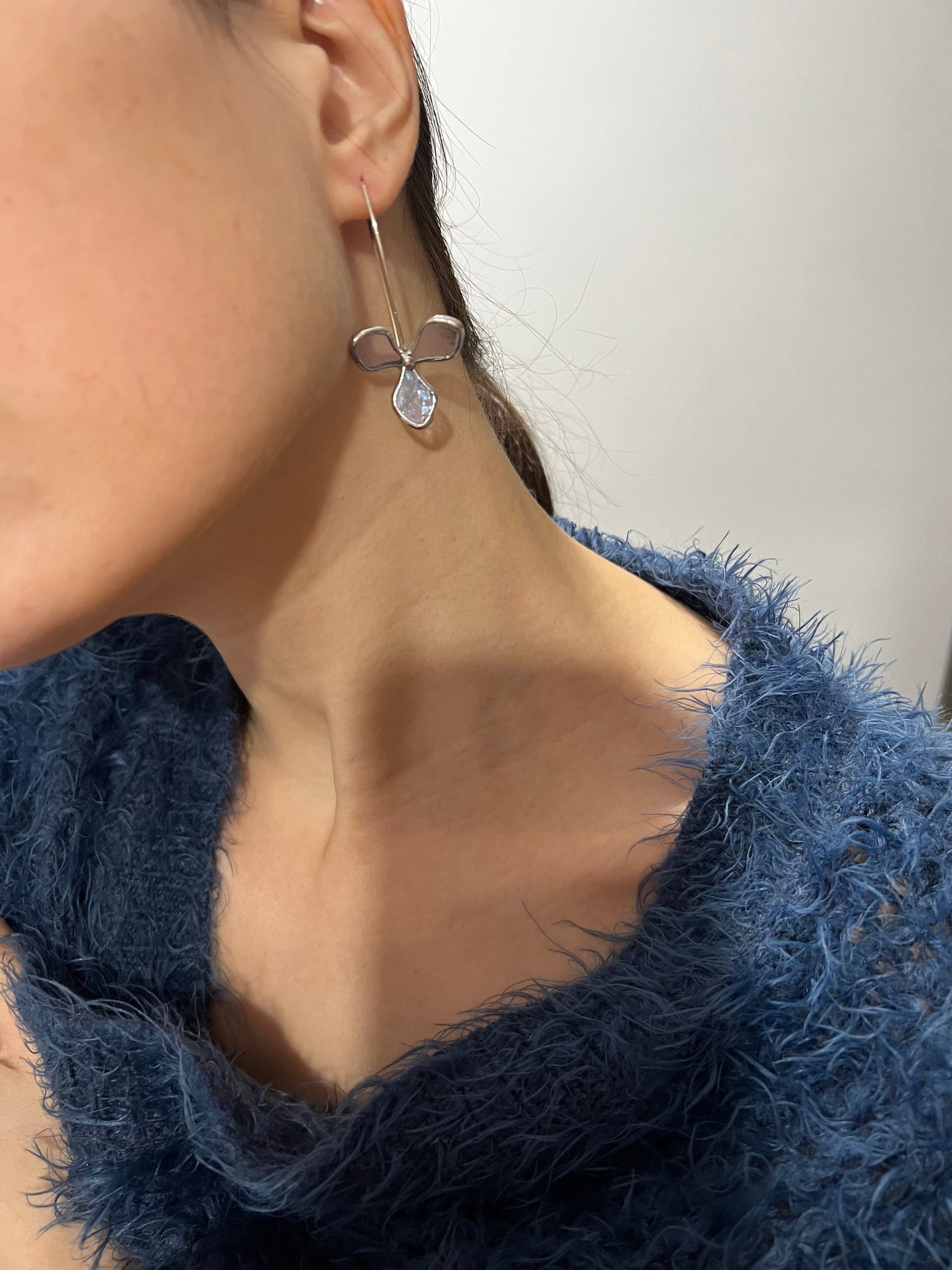 Light purple stained glass hydrangea earrings on model close-up