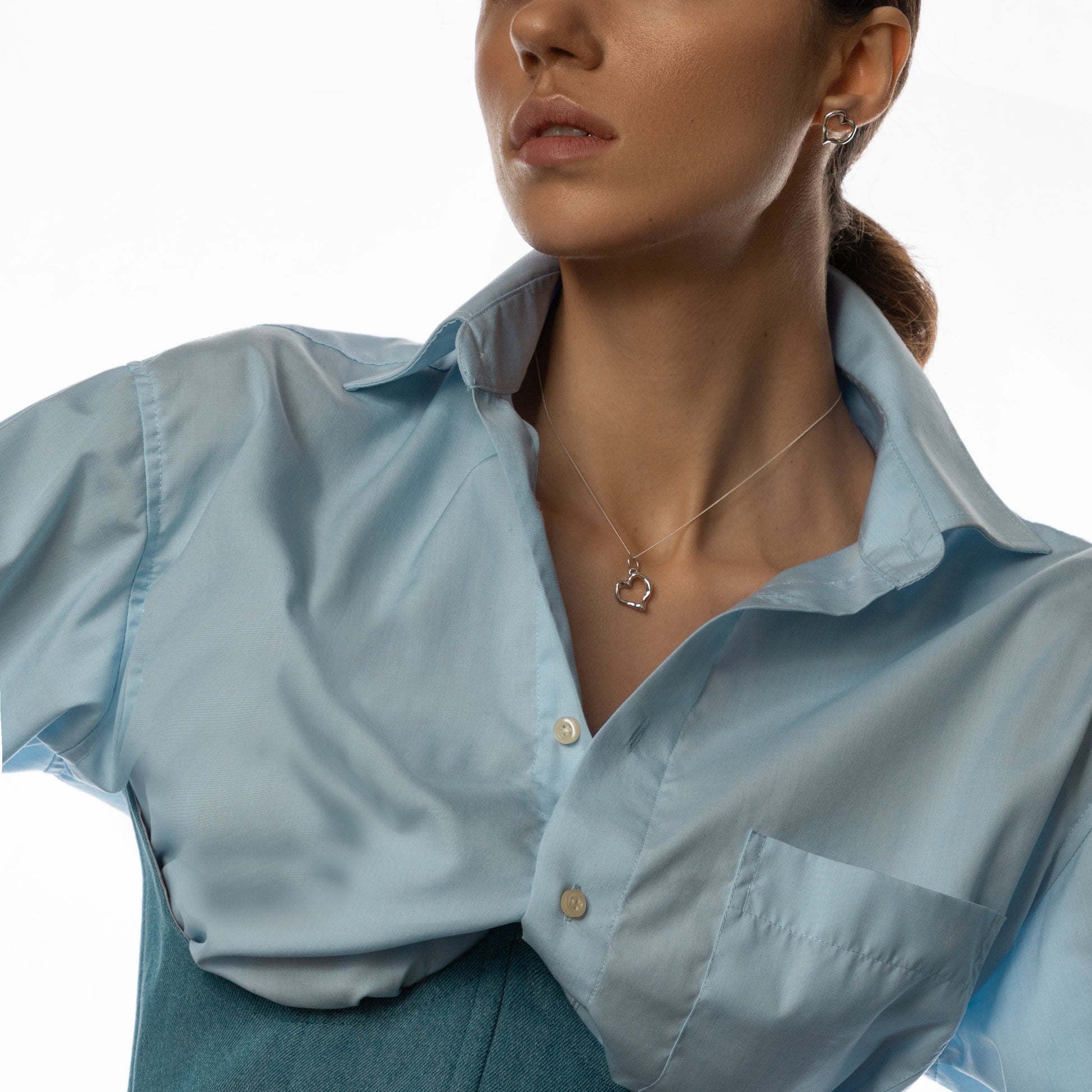 model wearing silver heart choker — elegant modern jewelry gift
