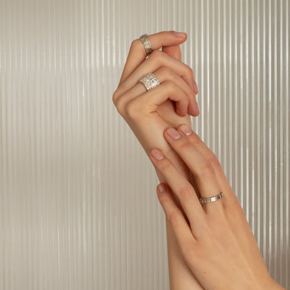 Modern chunky silver ring on model’s hand – statement jewelry for her