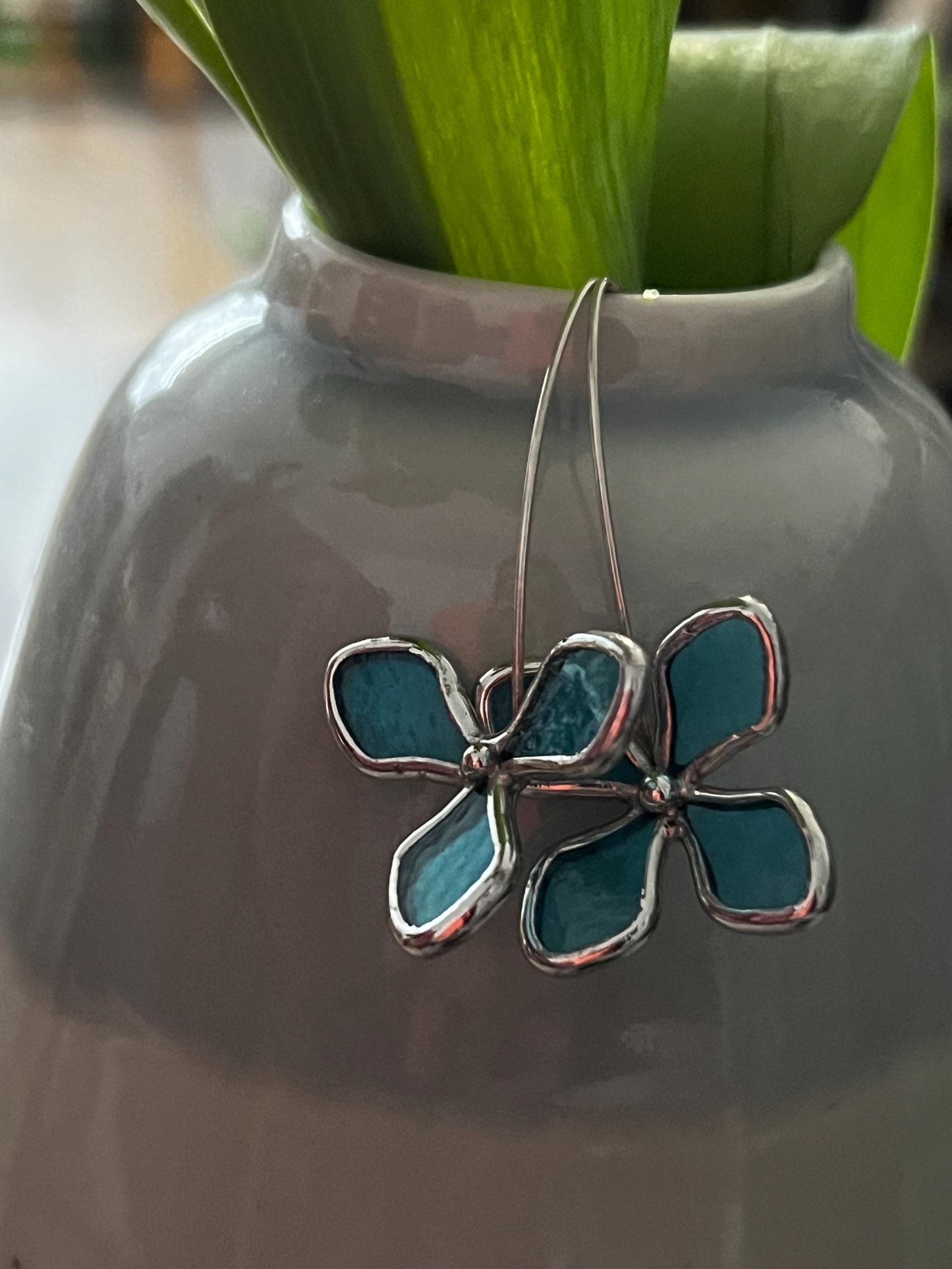 hydrangea earrings hanging on vase botanical decor styling