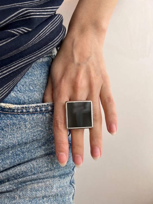black stained glass square ring on hand