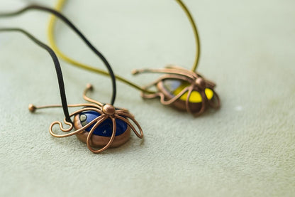 Blue stained glass butterfly pendant close-up