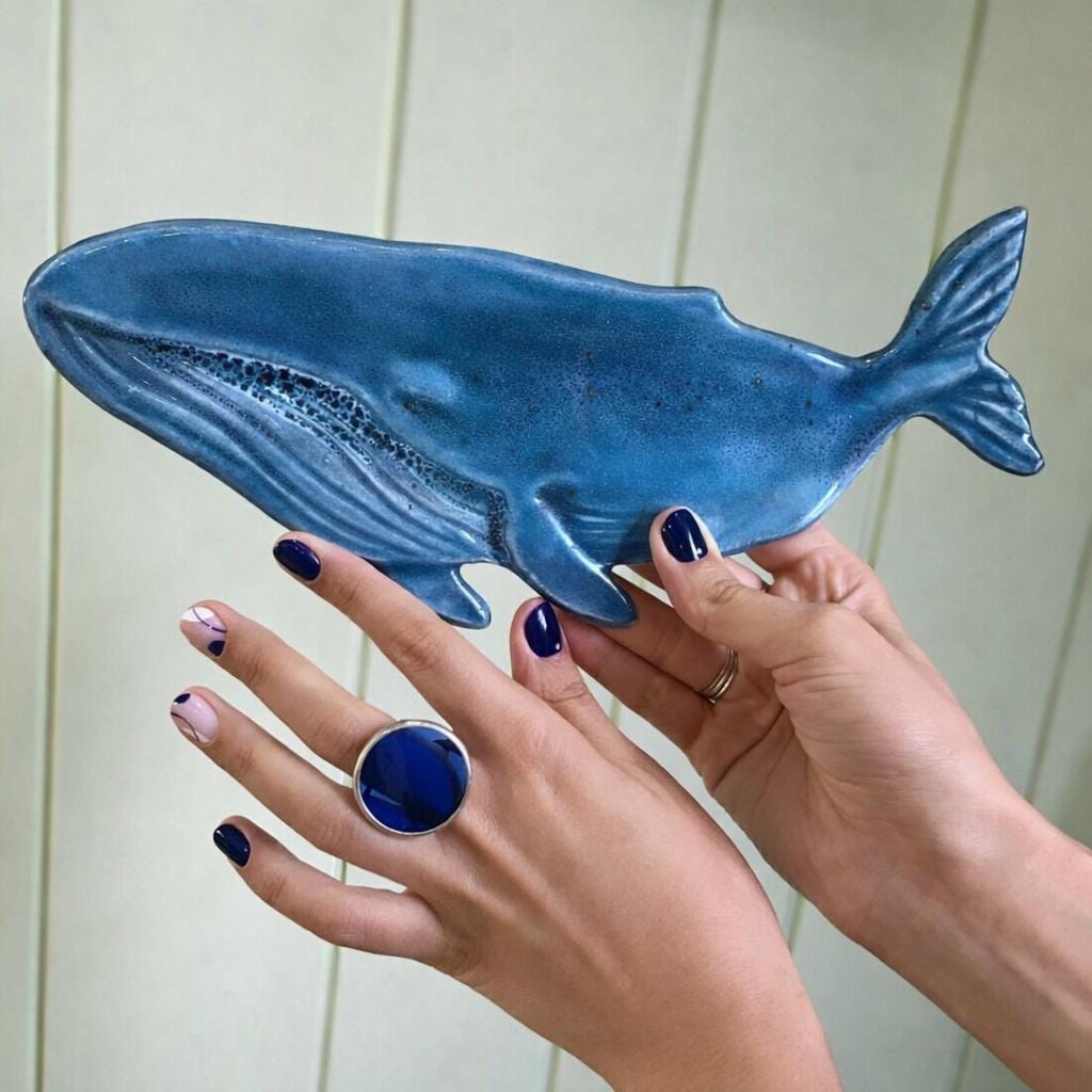 Blue stained glass statement ring with large geometric circle on hand