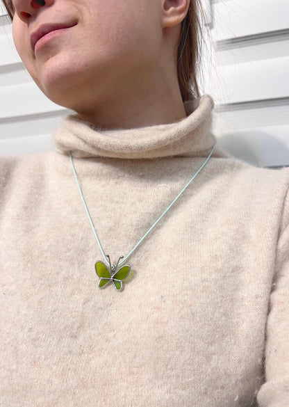 Nature inspired stained glass butterfly jewelry on neck