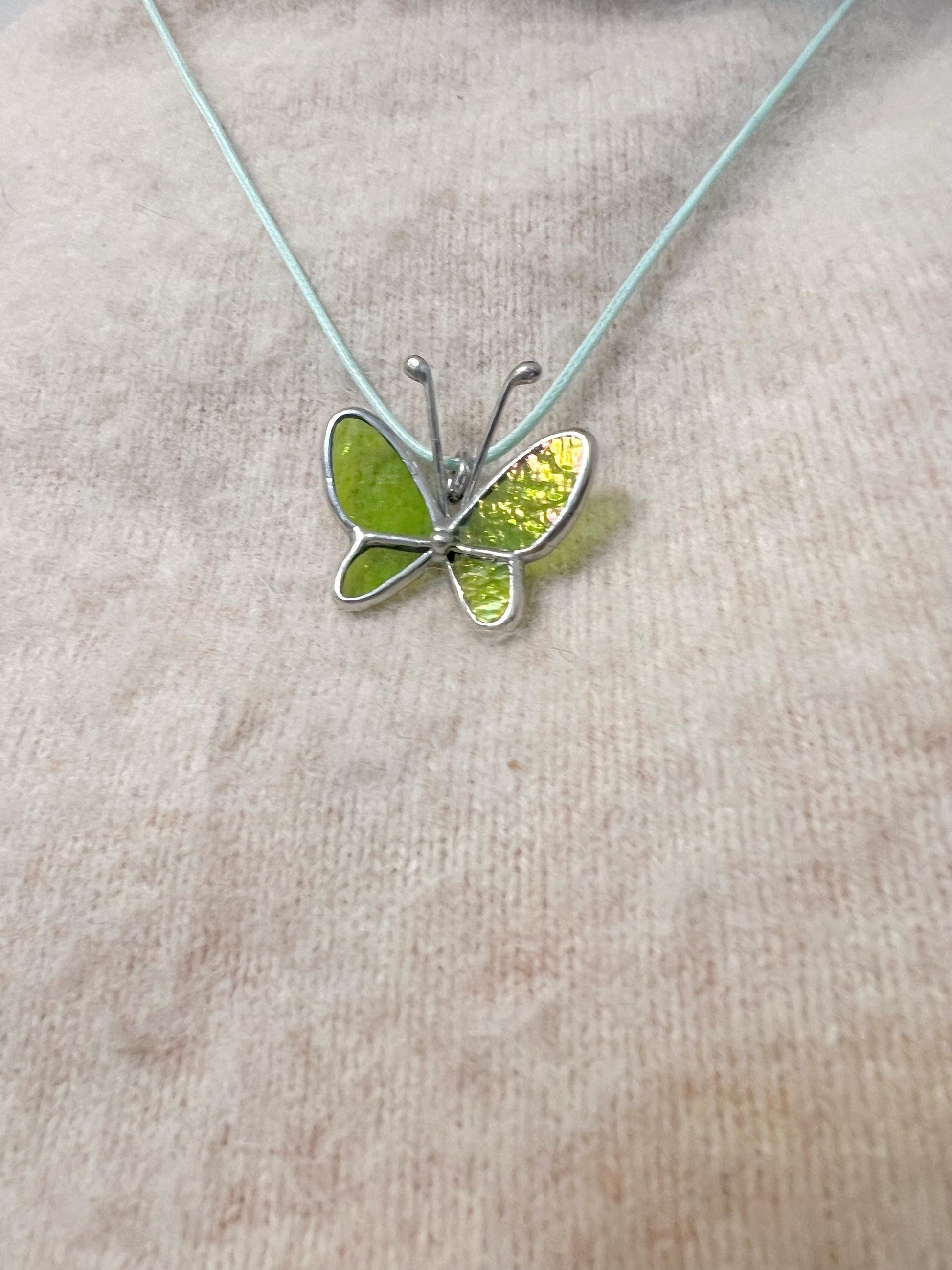 Handmade glass butterfly pendant close up, Tiffany technique