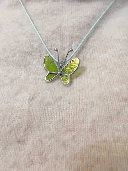 Handmade glass butterfly pendant close up, Tiffany technique