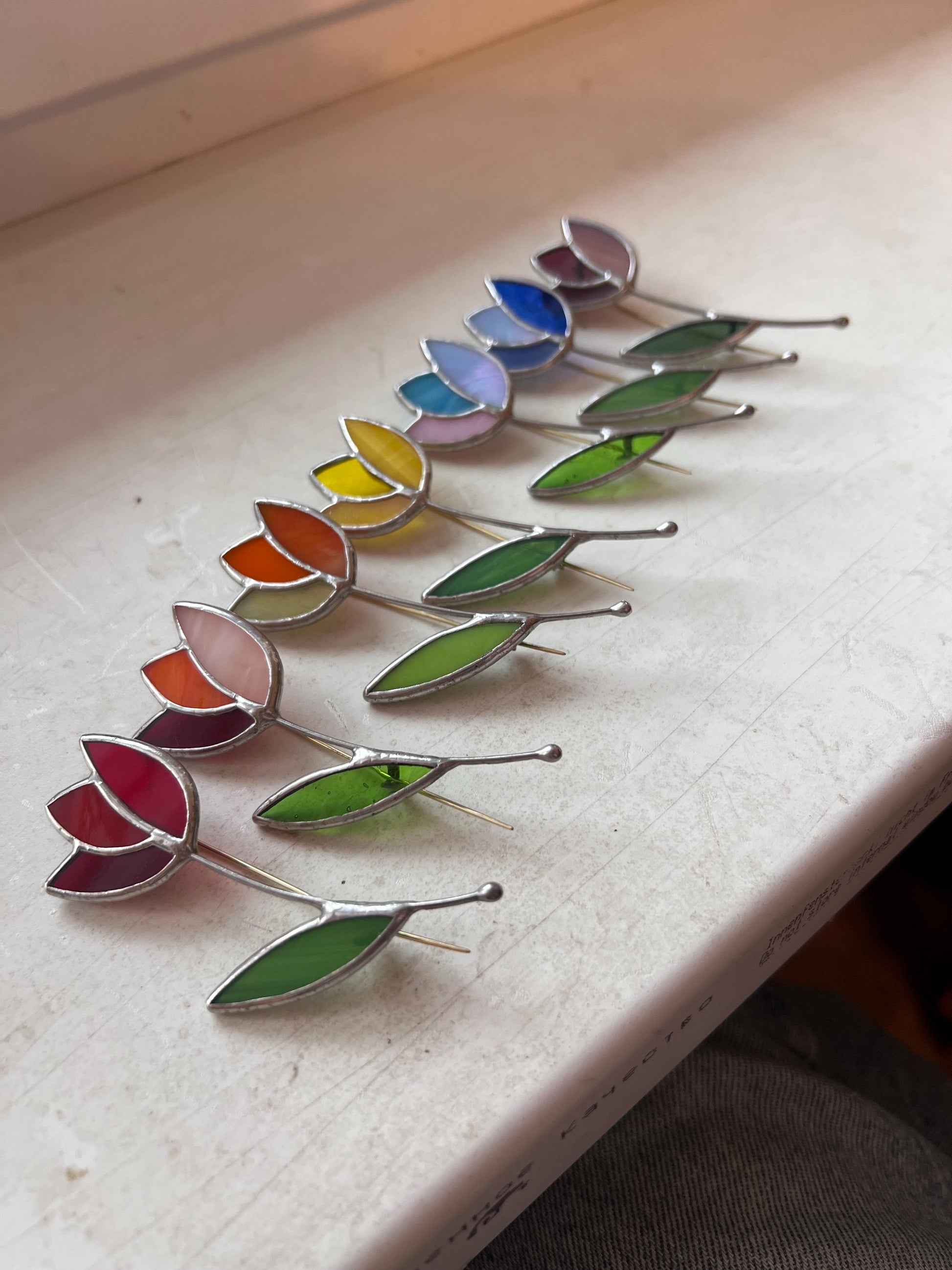 Rainbow stained glass tulip brooch collection handmade botanical flower pins in multiple vibrant summer colors